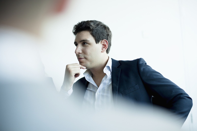 Young businessman listening in a business meeting